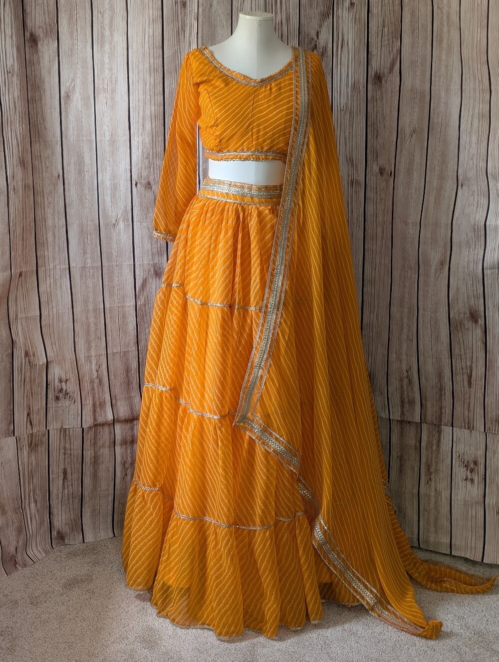 Orange Yellow and gold border Tiered Georgette Lehenga Choli Set